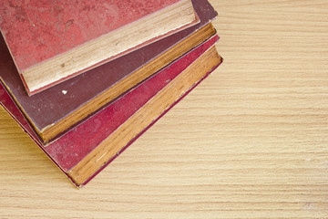 top shot stack of old book pages texture with space.