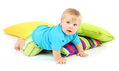 Little boy and color pillows, isolated on white