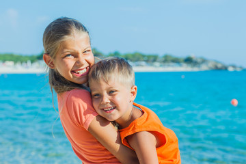 Fototapeta na wymiar Smiling happy kids on the beach