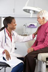 Doctor Examining Senior Female Patient