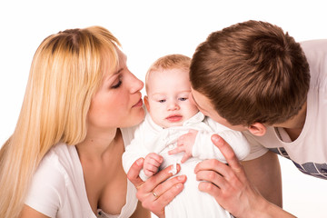 Portrait of a young happy family: mother, father and baby