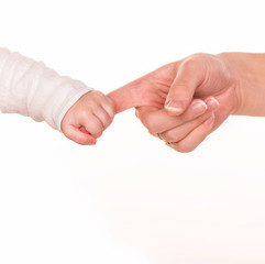 Baby holds mother's finger, trust family help concept