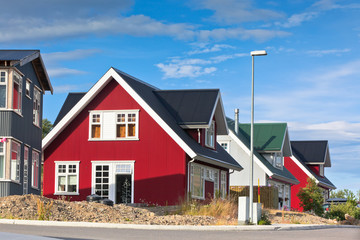 Fototapeta premium Bright Siding Houses in Small Iceland Town