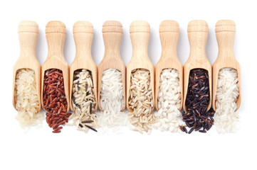 Wooden scoops with different rice types scattered from them
