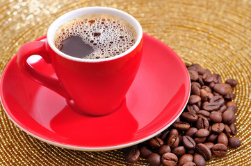 cup of coffee and coffee seeds