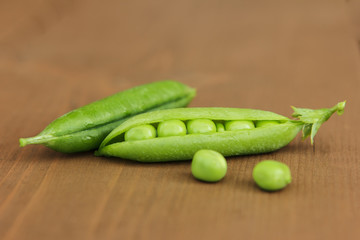 Pod of open green peas