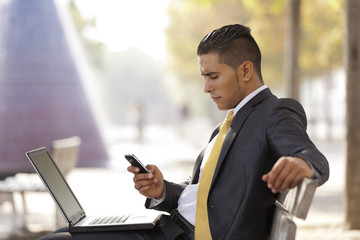 Fototapeta premium Businessman working in the park