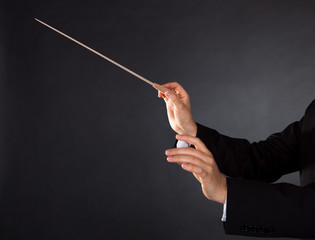 Music conductor with a baton