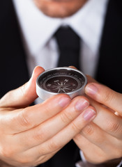 Businessman looking at a compass © Andrey Popov