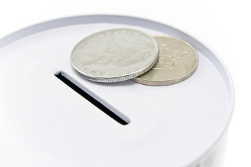 Tin money box with coins