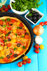 colorful composition of delicious pizza, vegetables and spices