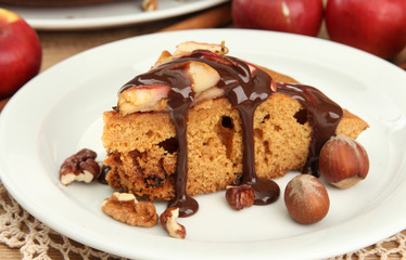 slice of tasty homemade pie with chocolate and apples,