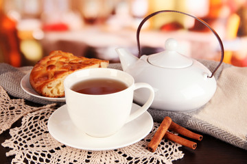 cup of tea with scarf on table in room
