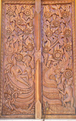 Wood carving decorated at windows of the temple, hand made by Th