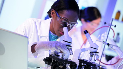 Female Pharmaceutical Researchers Modern Laboratory