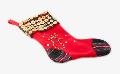 Christmas sock decorated with buttons.