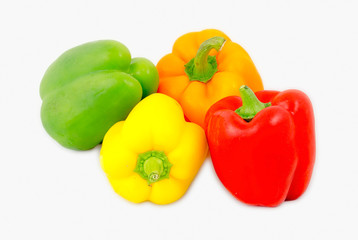 A mix of differently colored bell peppers isolated on white back