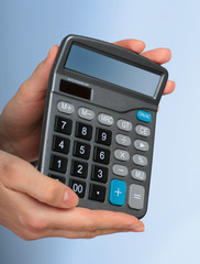 Calculator in hands.