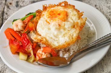 a fried egg on rice.