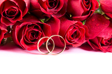 Wedding concept with roses and wedding rings