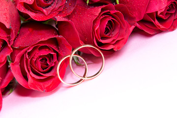Wedding concept with wedding rings and roses
