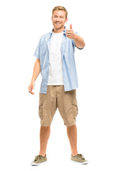 Attractive young man thumbs up full length on white background