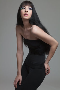 Fashion model with long dark hair.