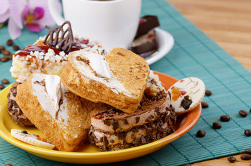 Heart shaped cake with coffee cup  aside