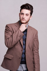 Elegant young handsome man. Studio fashion portrait.
