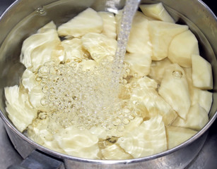 Fresh Peeled Potatoes In A Pot Of Water - ready for cooking