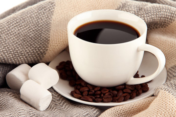 cup of coffee with scarf close-up