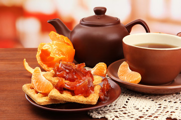 light breakfast with tea and homemade jam, on wooden table