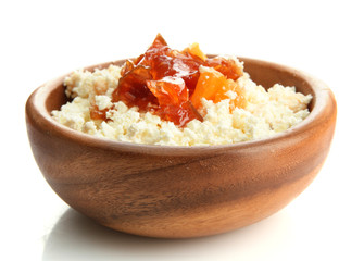 cottage cheese in wooden bowl with homemade tangerine jam,