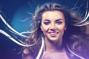 Naklejka premium smiling girl with abstract lines on wind