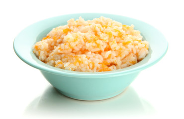 Taste rice porridge with pumpkin in blue bowl, isolated