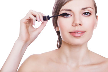 woman with mascara brush