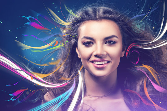 smiling girl with rainbow on wind