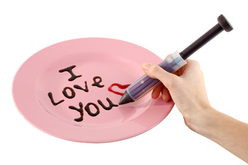 Chocolate inscription on plate isolated on white