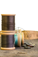 Thread and needle with buttons