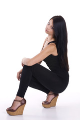 Young happy attractive girl posing in studio .