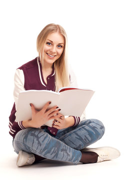 Young woman reading magazine