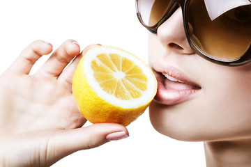 woman in sunglasses with lemon