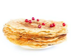 Pancakes with berries on a white plate