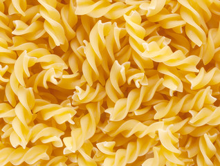 Background of twisted raw pasta