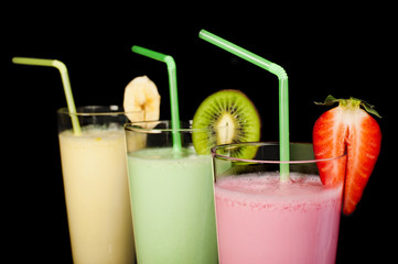 Banana, kiwi and strawberry milk shake and fresh fruis