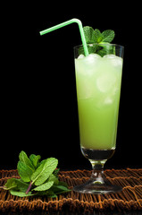 Green cocktail with cubes ice