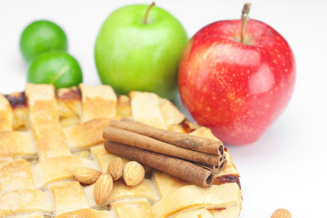 Fototapeta na wymiar apple pie, apples, cinnamon and lime isolated on white