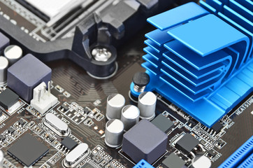 Printed computer motherboard board with microcircuit, close-up