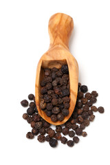 black pepper in a wooden scoop