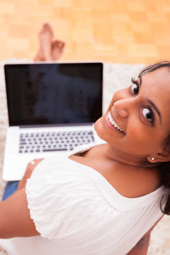 Young Indian Woman Using A Laptop